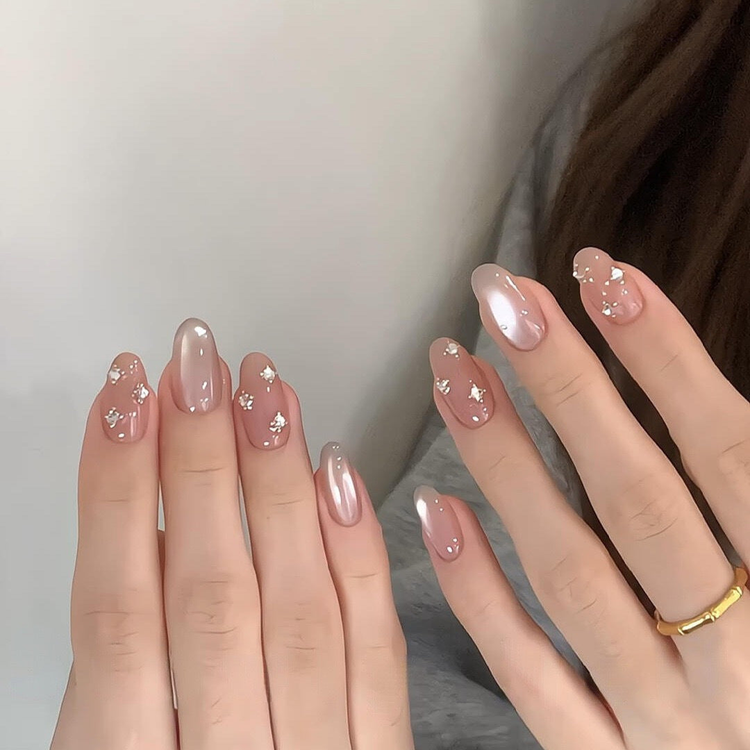Glamorous artificial nails with shimmering effect and elegant rhinestone details Kalsten