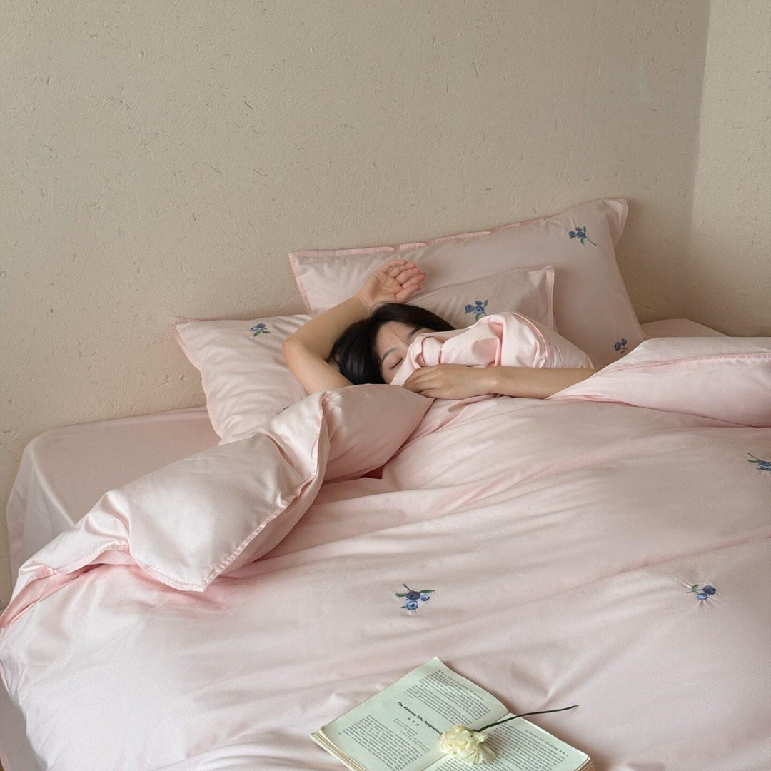 Luxurious cotton satin bedding set with delicate berry embroidery and silky-matte finish