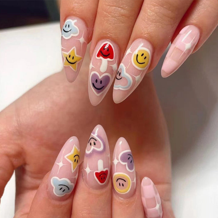 Creative nail art with playful emoji motifs Kalsten