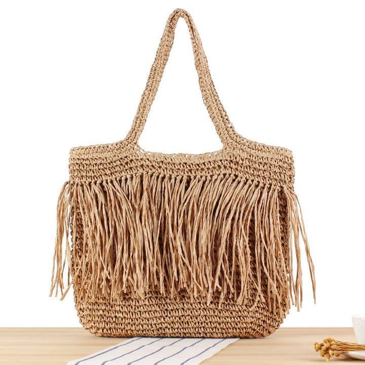 Designer straw bag with fringe decoration Kalsten