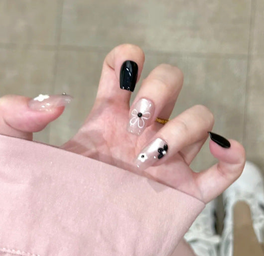 Artistic Press-On Nail Design with Floral Accents Kalsten