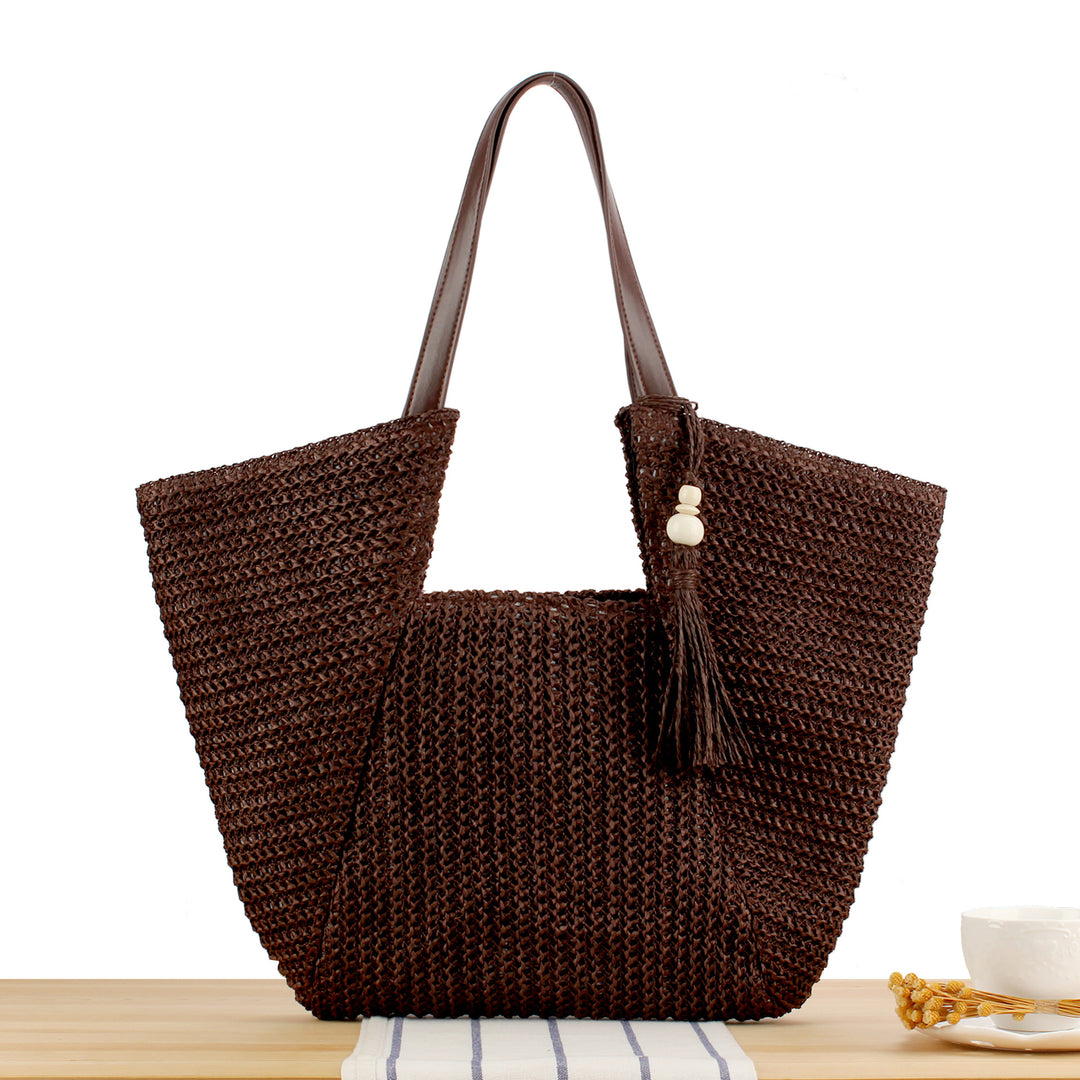 Beach bag made of natural weave with elegant leather accents Kalsten