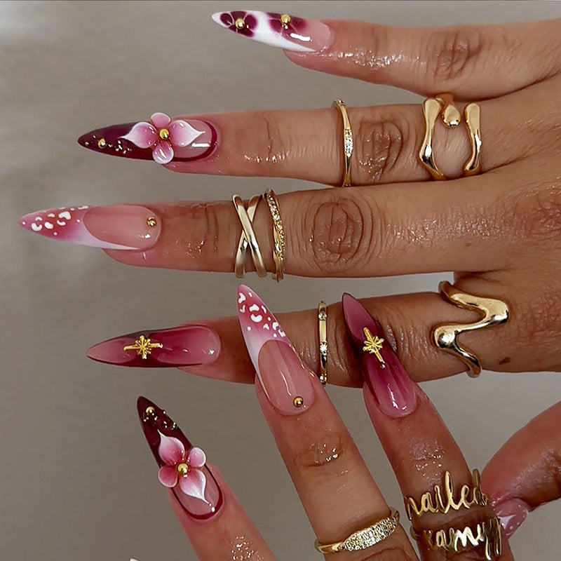 Artifical nail set with delicate floral design and glamorous accents Kalsten