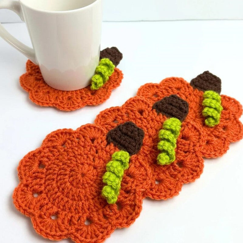 Hand-crocheted pumpkin pot holder and table mat made of cotton yarn