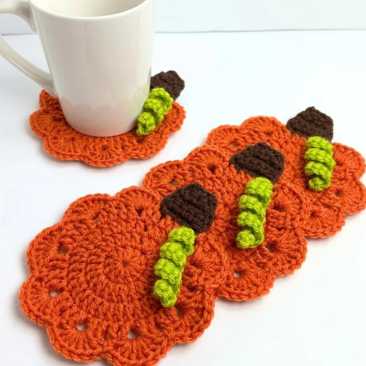 Hand-crocheted pumpkin pot holder and table mat made of cotton yarn