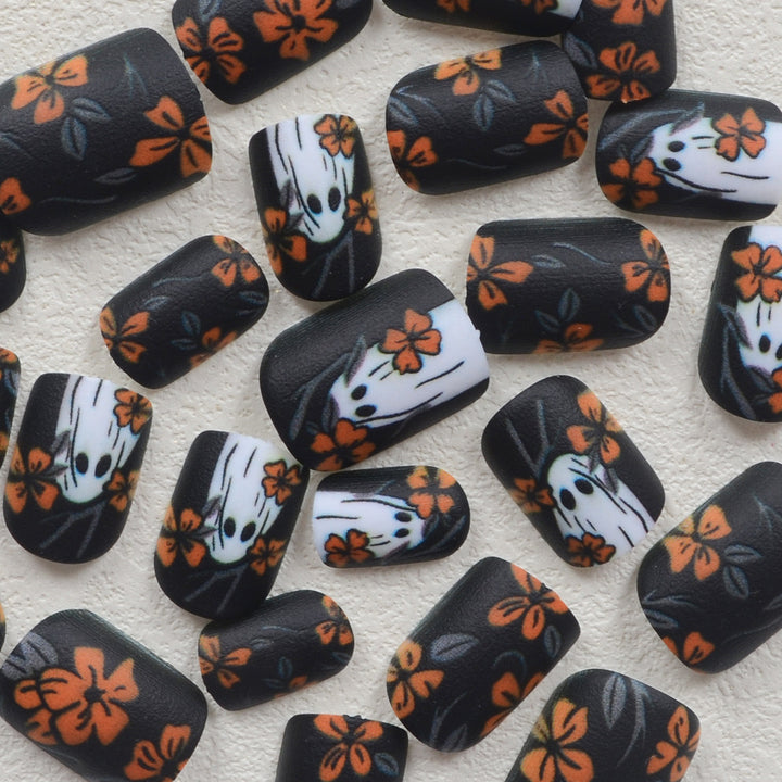 Acrylic nail set with spooky ghost design and floral accents Kalsten