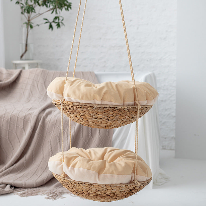Hanging chair made of braided natural material with comfortable cushions Kalsten