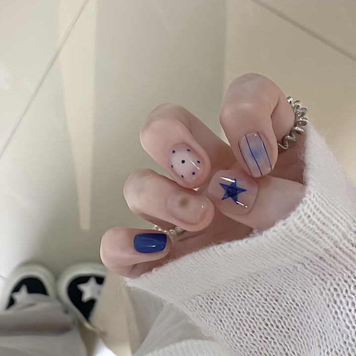 Artificial nails in modern design with geometric and sparkling accents Kalsten
