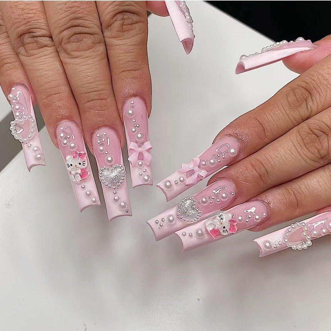 Artificial nail set with playful 3D care and pearl decorations Kalsten