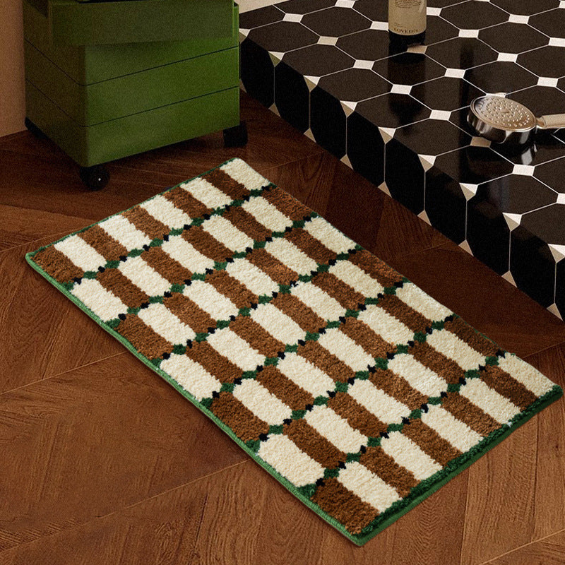 Hand-tufted bathroom mat with a velvety pile, non-slip latex backing, and geometric honeycomb check pattern Kalsten