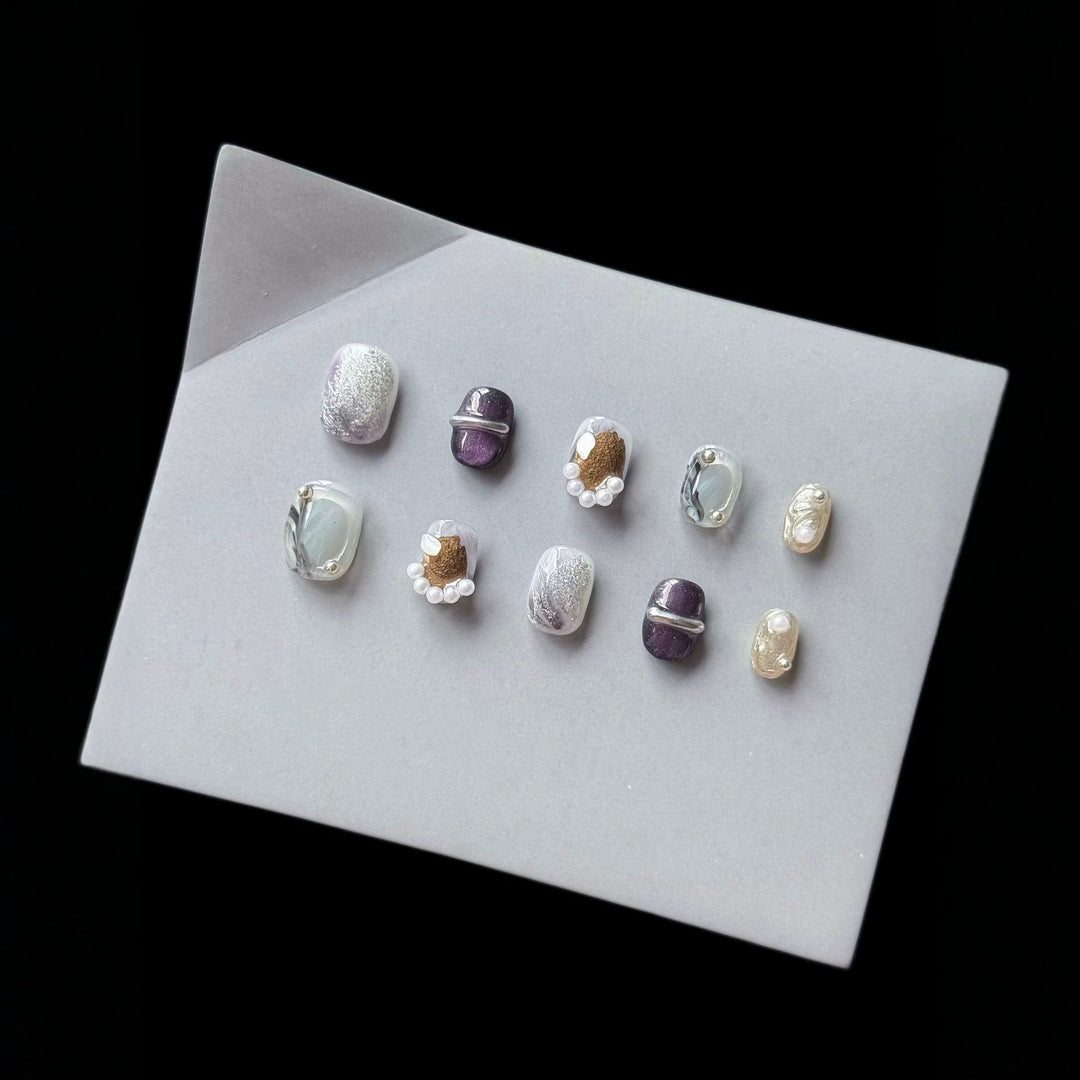 Artistic Press-On Nail Art Set with Unique Textures and Pearl Accents