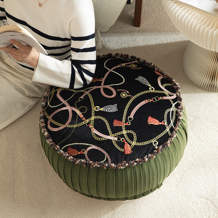 Round decorative floor cushion pouf with velvety printed top, pleated side wall, and fringe edge Kalsten