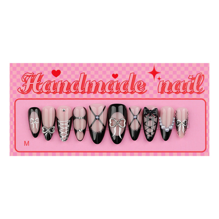 Artful nail art with elegant bows and glitter accents Kalsten