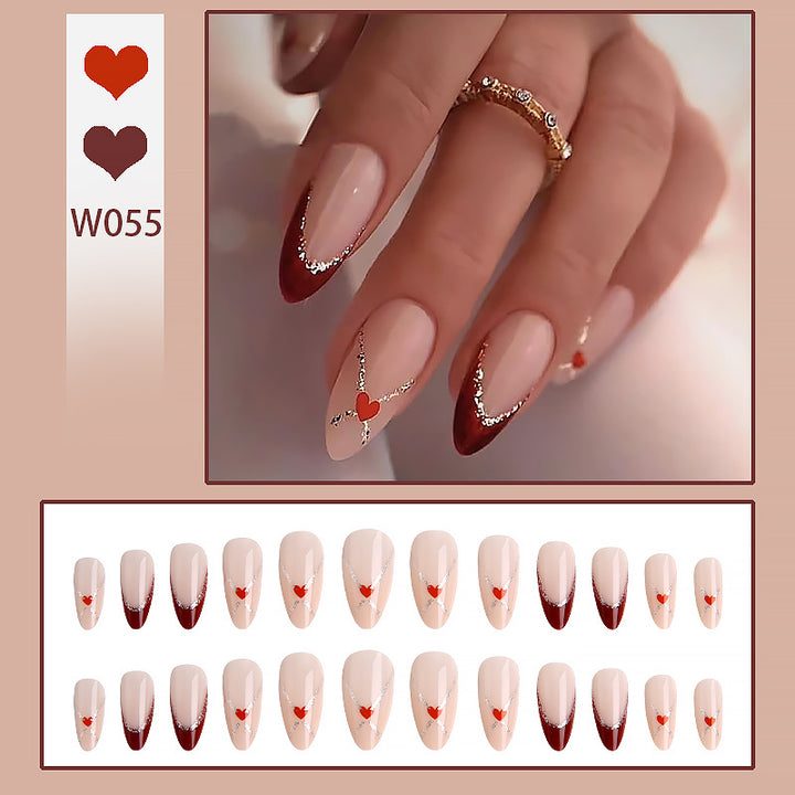 Acrylic nails with heart motifs and glitter details Kalsten