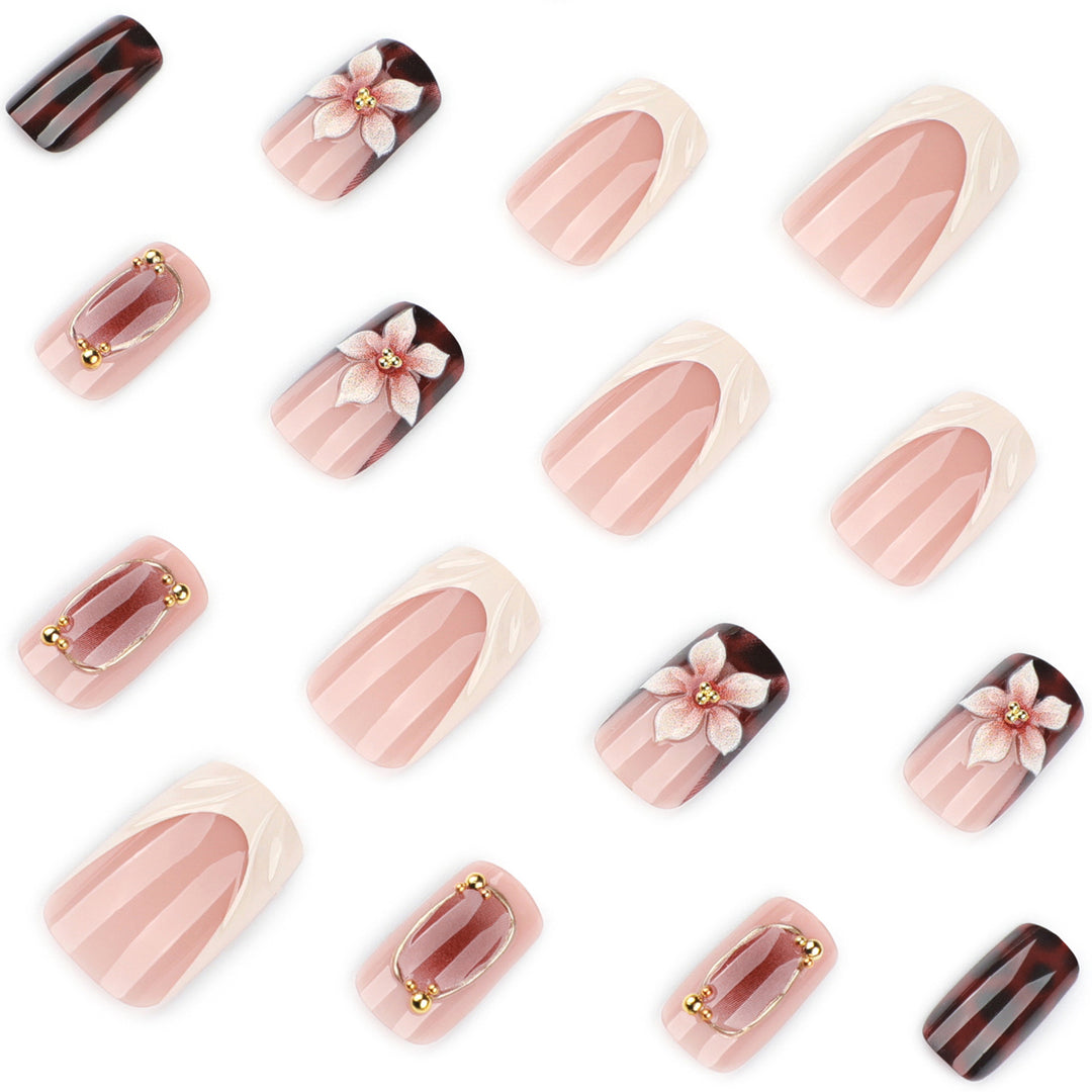 Artistic stiletto nails with elegant floral design and glitter effects Kalsten