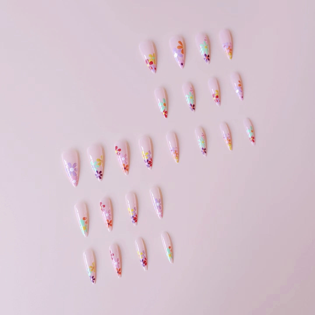 Acrylic nail set with vibrant floral designs and sharp accents Kalsten