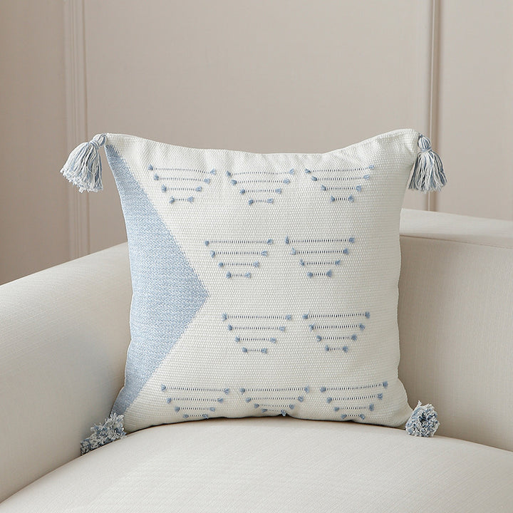 Decorative woven cushion cover with geometric tuft-relief and tassels Kalsten