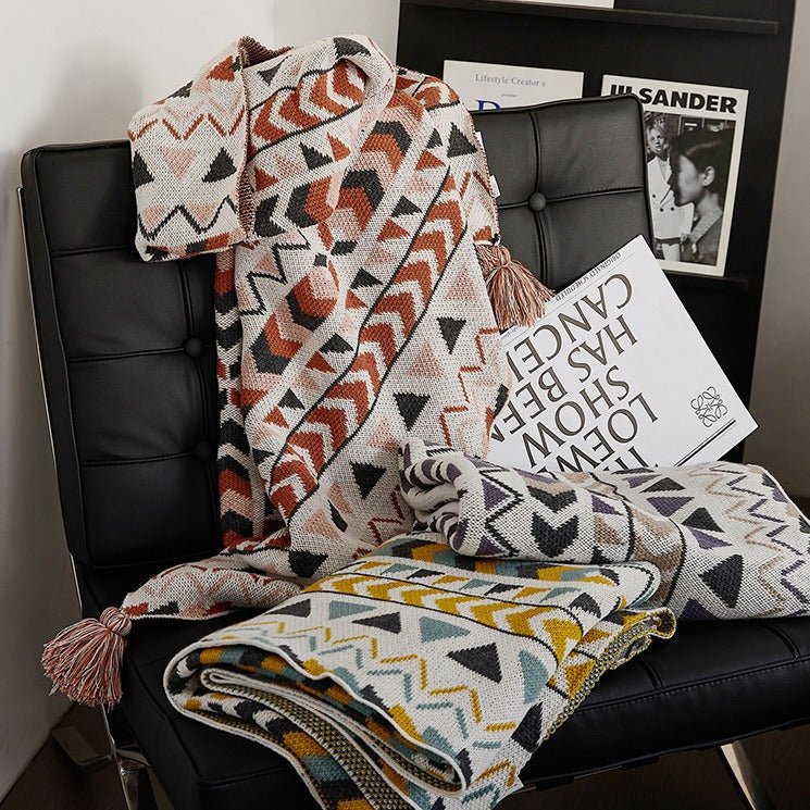 Patterned throw blanket in ethnic knit design with tassels