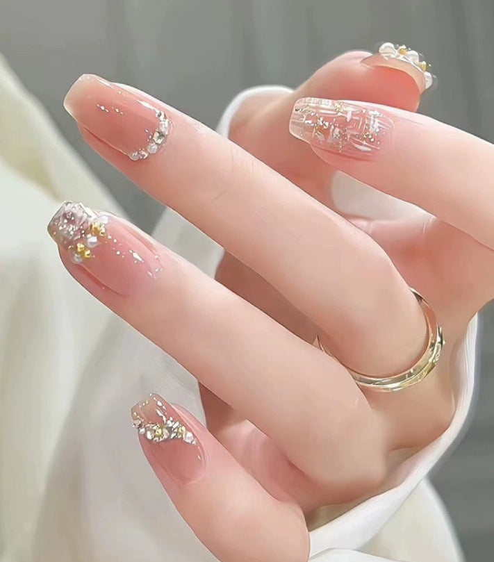 Elegant nail design with pearl embellishment Kalsten