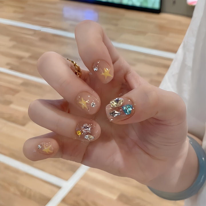 Glittering nail tips with elegant jewelry accents Kalsten