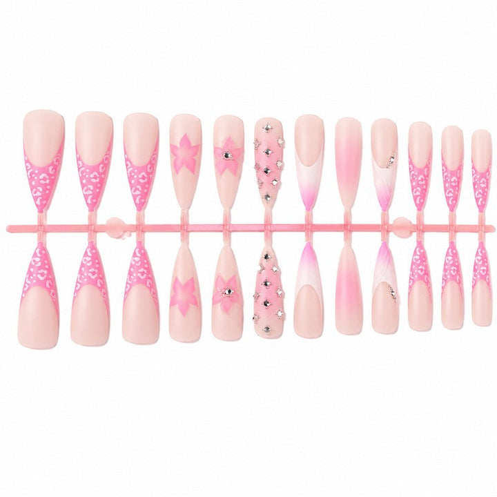 Nail art set with elegant floral embellishments and glamorous accents Kalsten