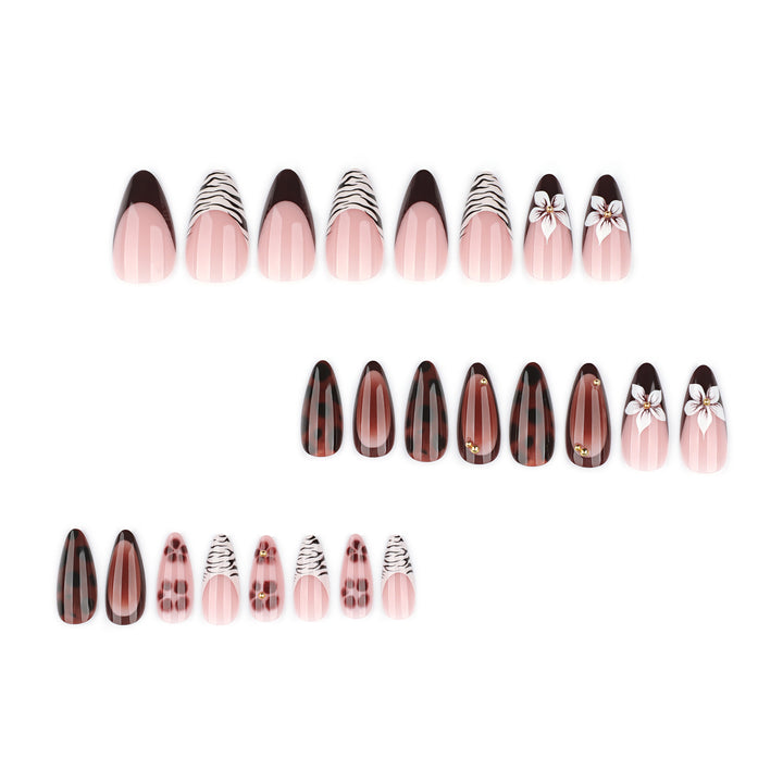 Artistic stiletto nails with elegant floral designs and glitter accents Kalsten