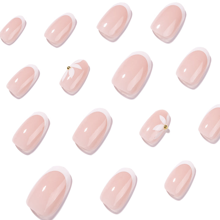 Artful French nails with delicate flowers and glitter accents Kalsten