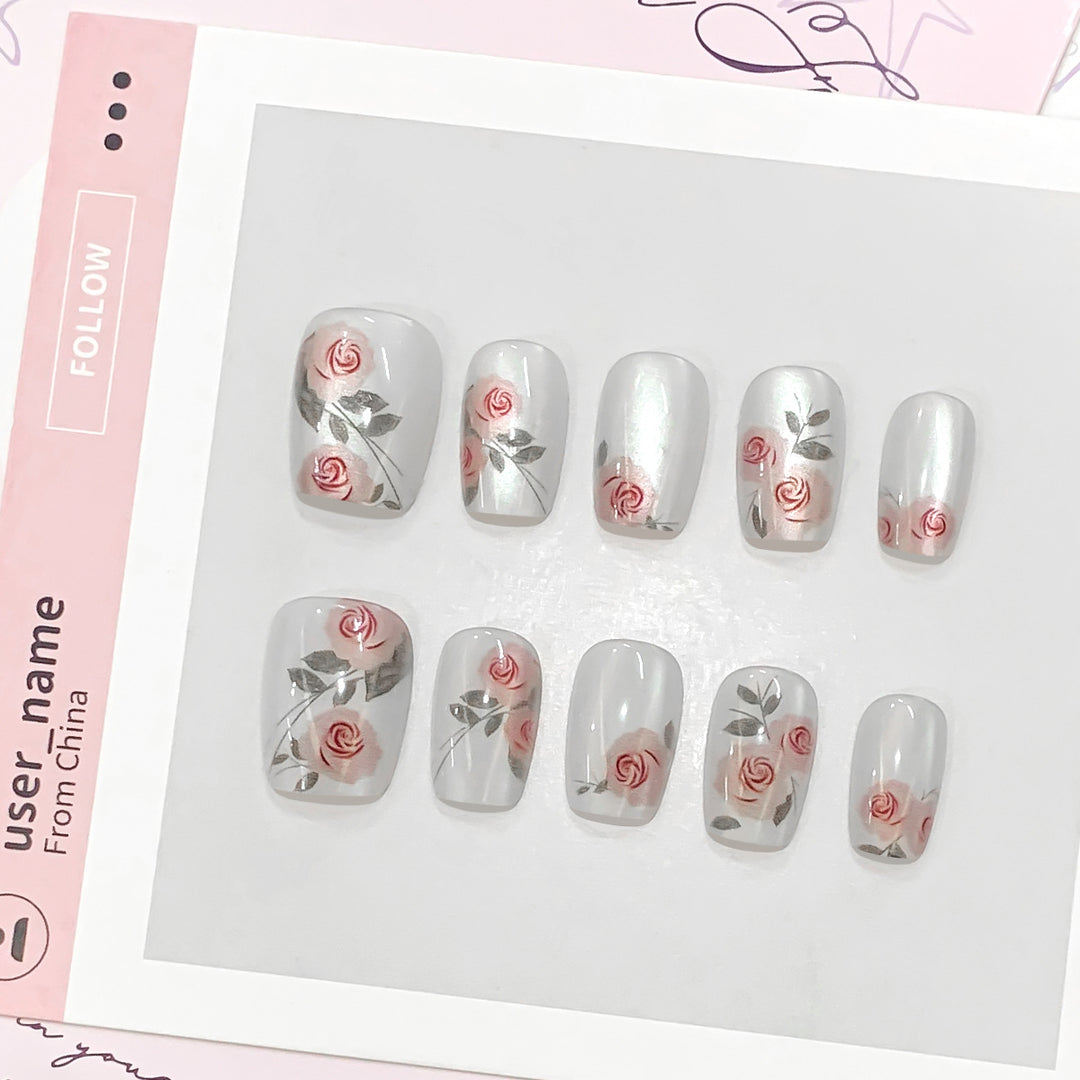 Artful nail extensions with rose designs Kalsten