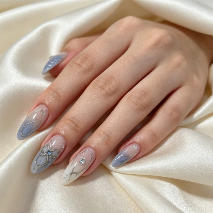 Artistic Press-On Nail Design with Floral and Gem Accents Kalsten