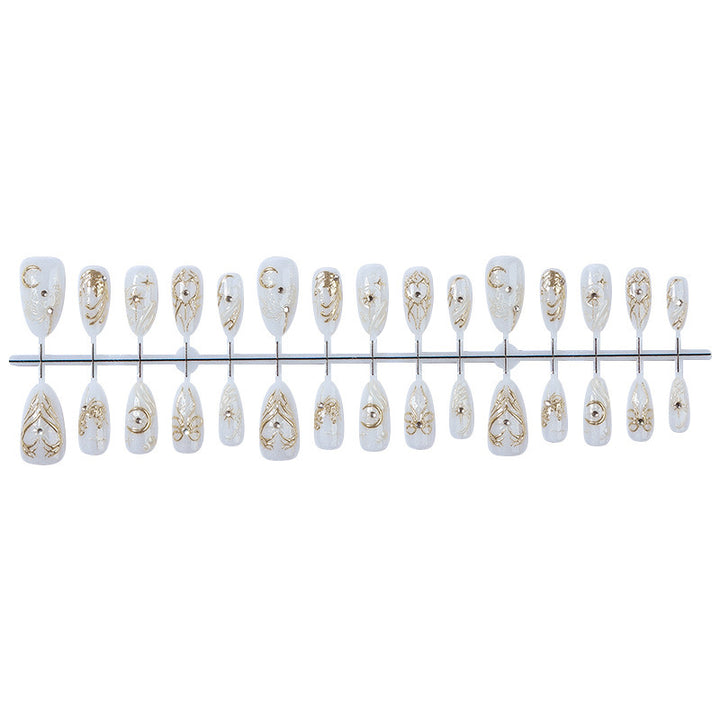 Acrylic nail set with elegant embellishments and glitter accents Kalsten
