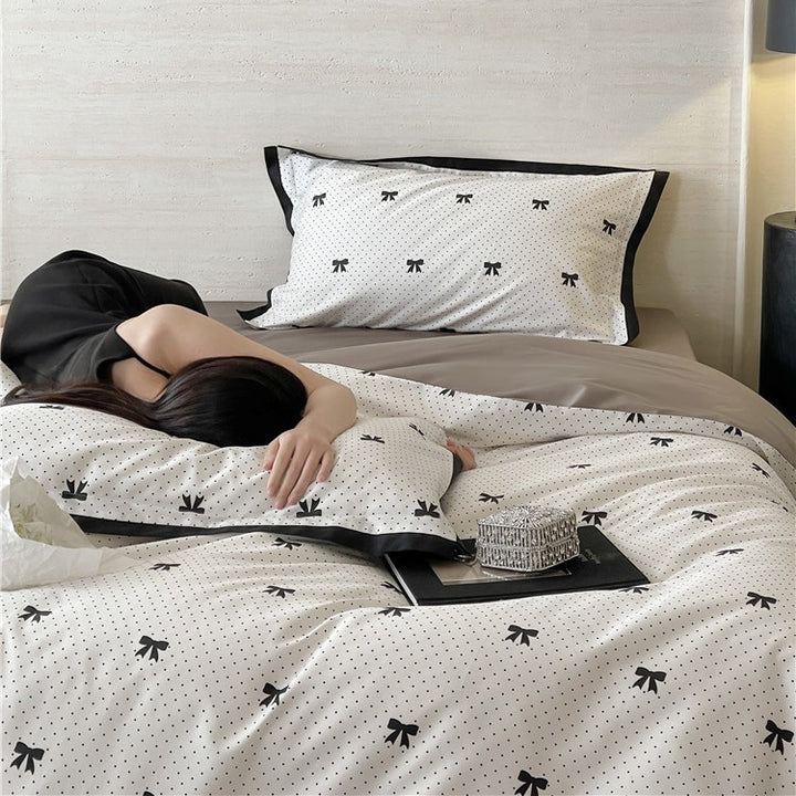 Luxurious cotton satin bedding set with butterfly motif and contrasting frame edge