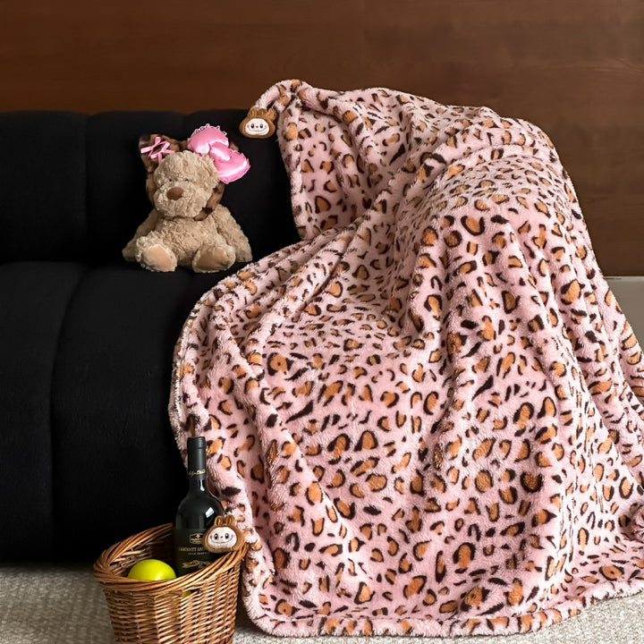 Cuddle blanket with extra soft microfleece quality and decorative leopard print