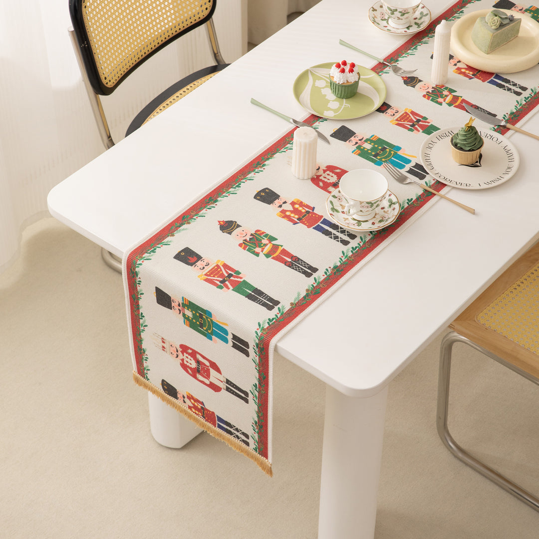 Festive woven table runner with nutcracker motif and golden fringes Kalsten