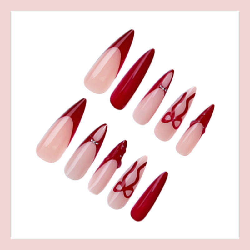 Artificial nails with elegant pointed designs and creative embellishments Kalsten