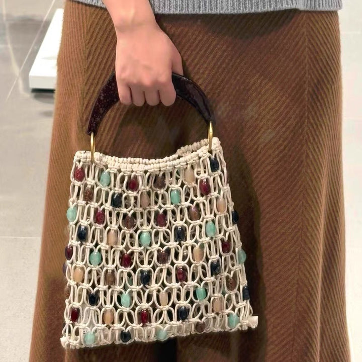 Handcrafted designer shoulder bag with unique stone accents Kalsten