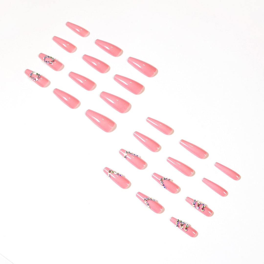 Artificial nail extensions with elegant rhinestone embellishments Kalsten
