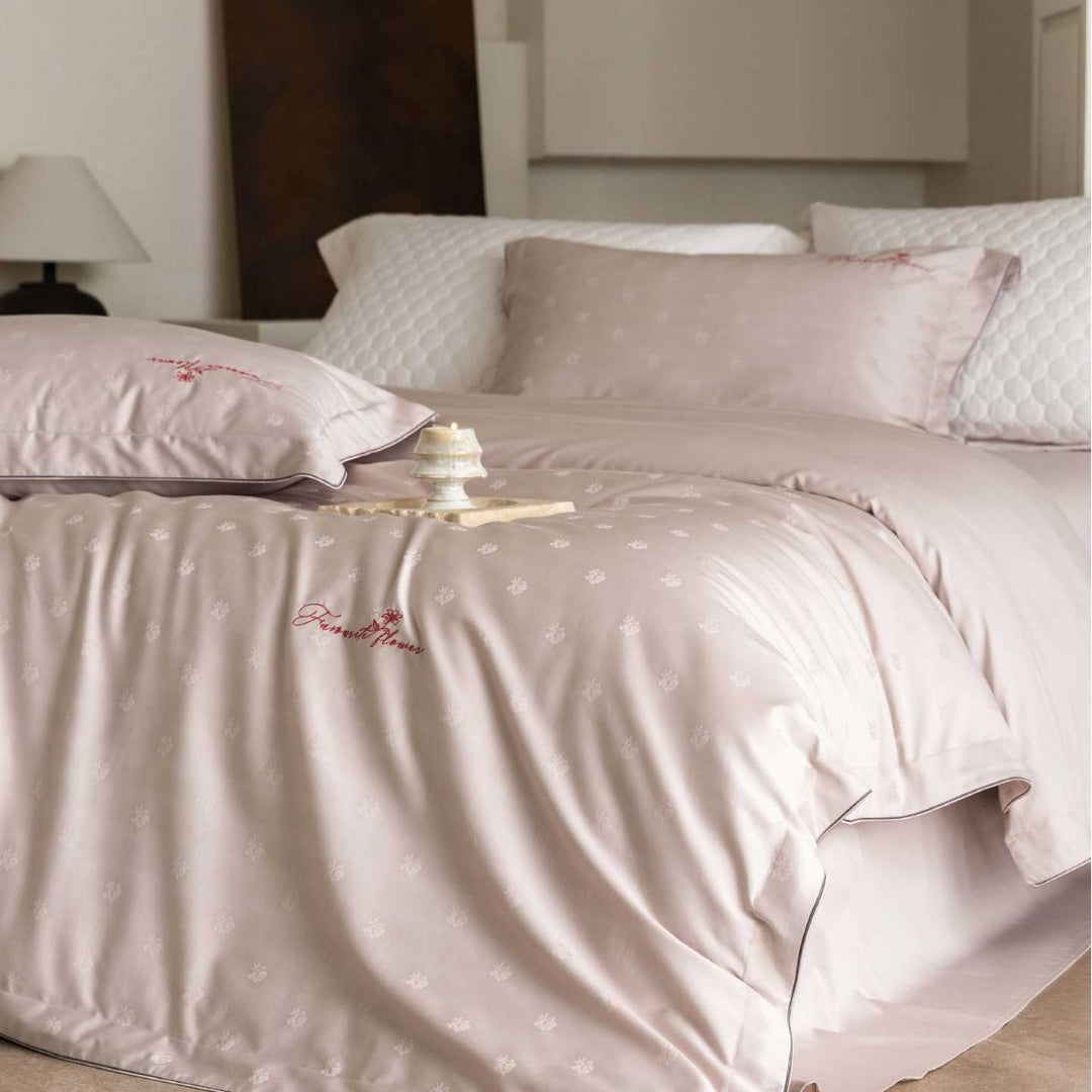 Luxurious satin bedding complete set with quilted cover and delicate logo embroidery