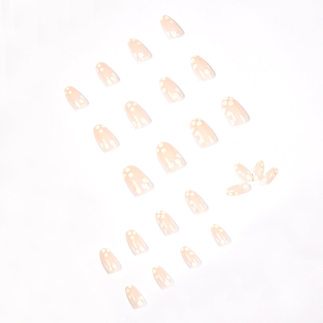 Artificial nail art with floral design and glitter accents Kalsten