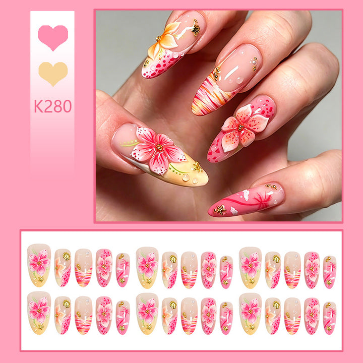 Artificial nails with floral embellishments and glitter accents Kalsten