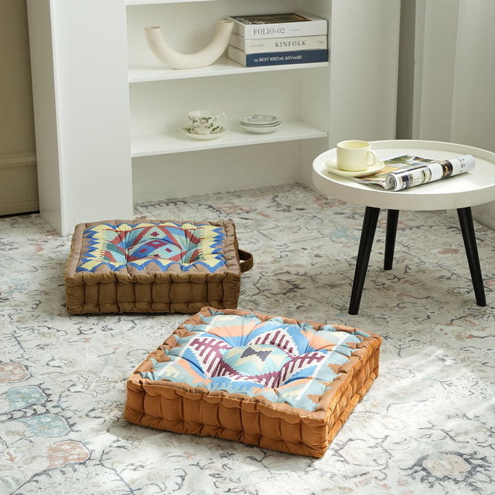 Padded seat and floor cushion with carrying handle and graphic ethno pattern Kalsten