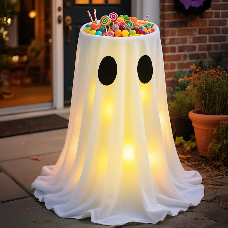 Glowing Halloween candy bowl with ghost wrap and LED interior lighting