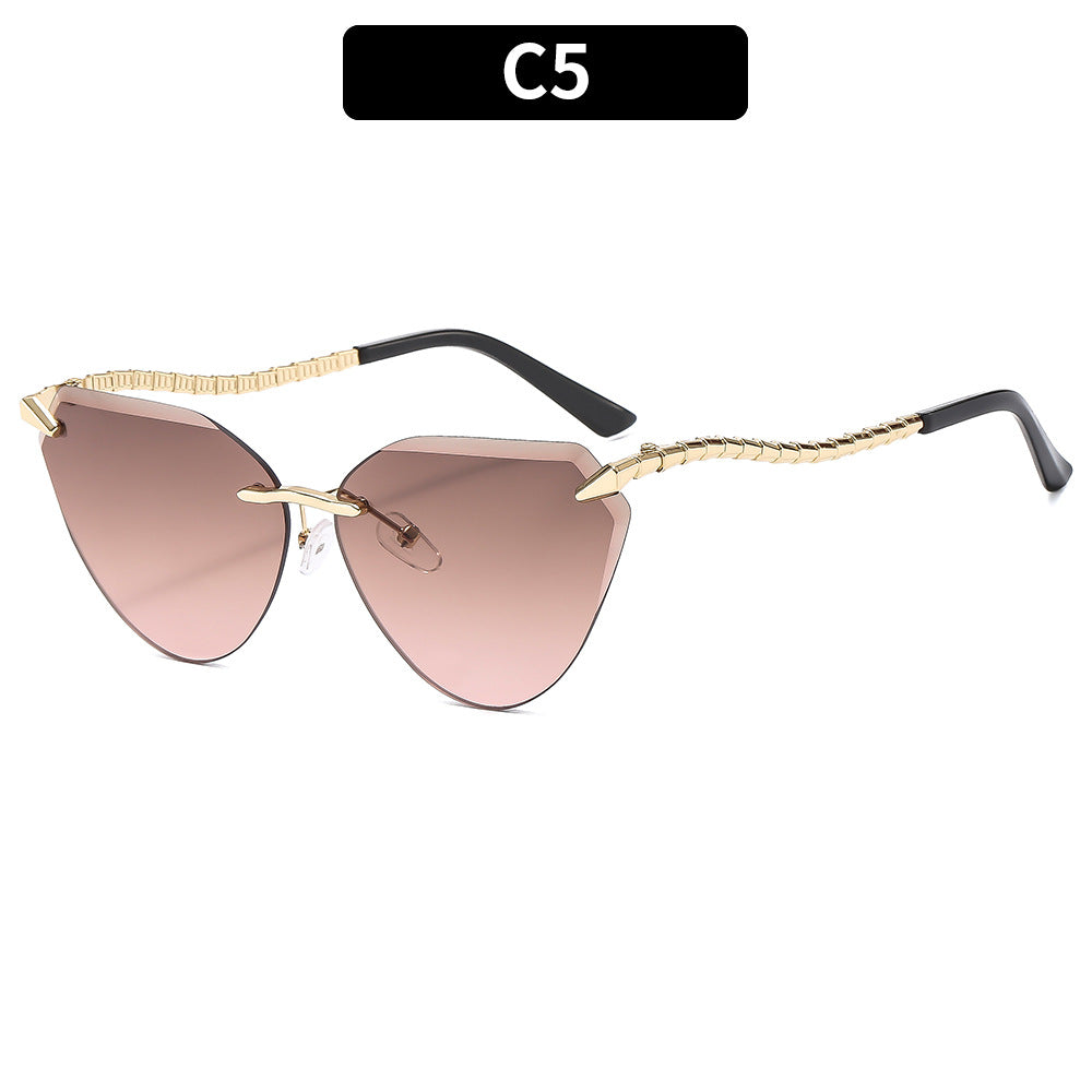 Sculptural Cat-Eye Sunglasses with Decorative Gold Accents