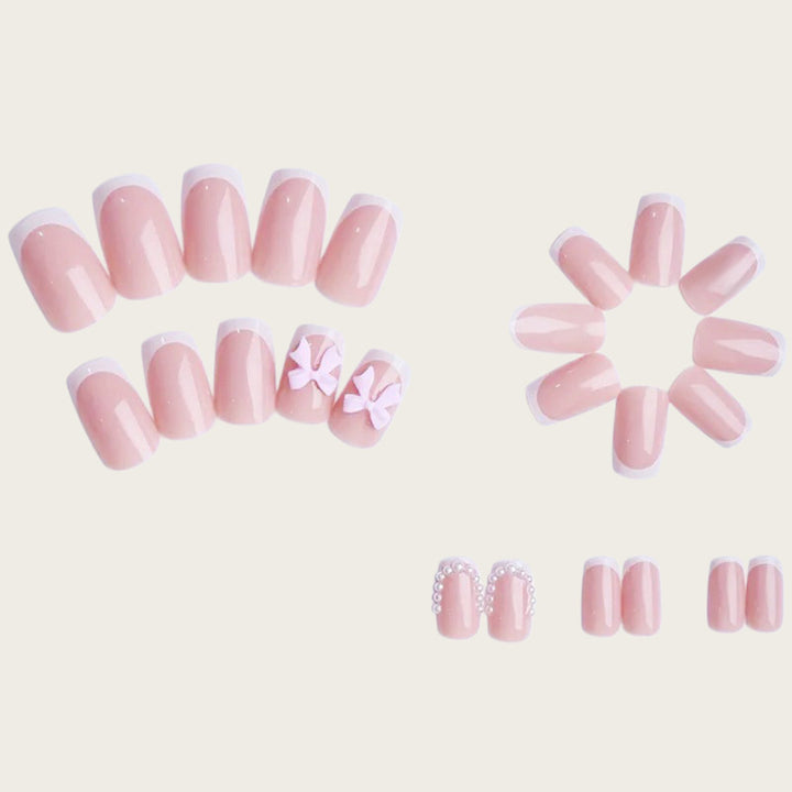Exclusive artificial nails with decorative bows and pearl details Kalsten