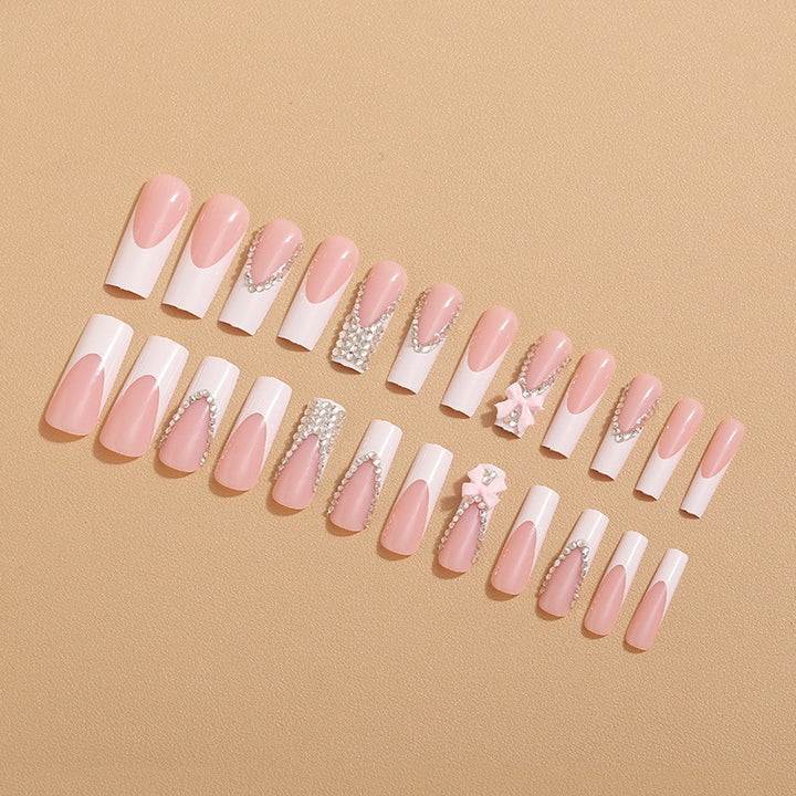 Artificial nails with glamorous rhinestone decorations and floral accents Kalsten