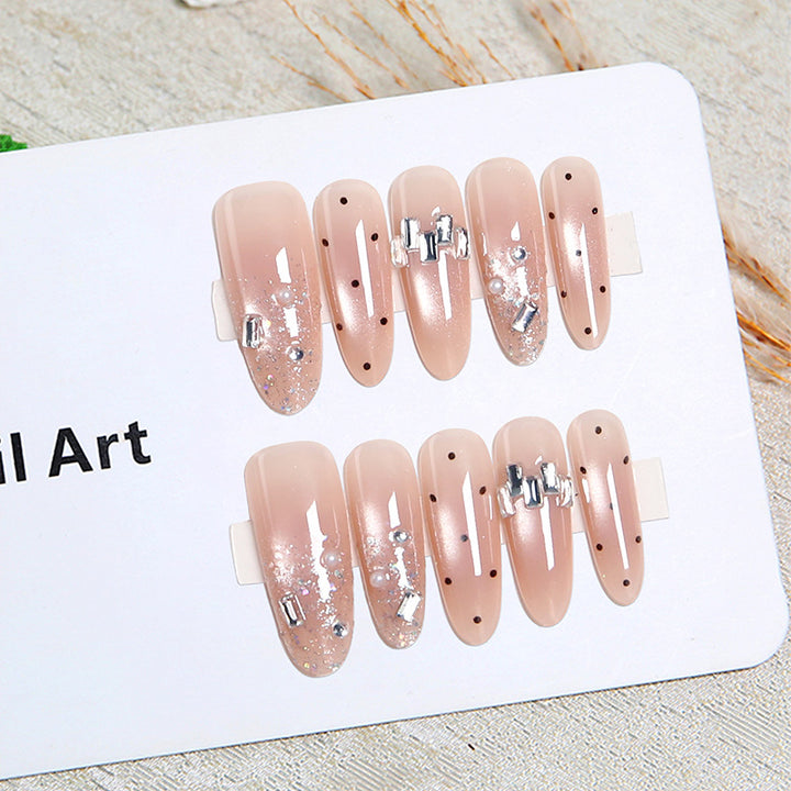 Artificial nail set with sparkling glitter and elegant jewelry details Kalsten