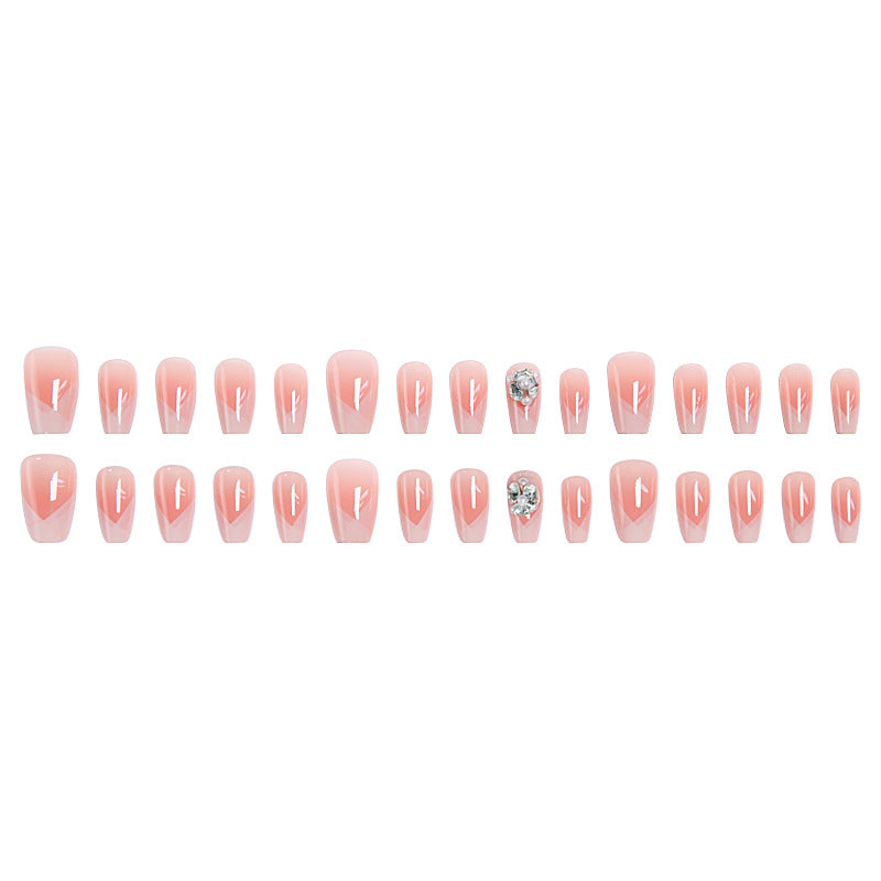 Artificial nail set with filigree tip designs and glamorous rhinestone accents Kalsten