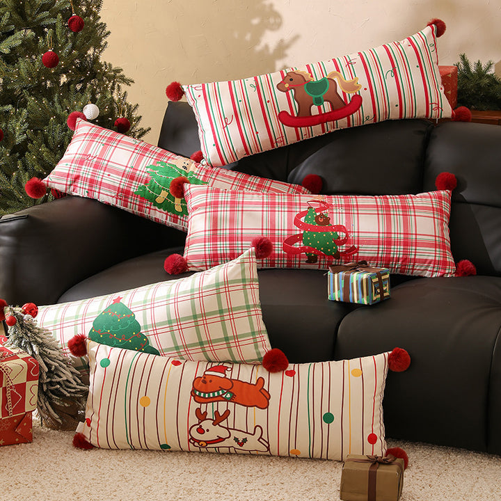 Long decorative lumbar and neck pillow in Christmas check with pompom and dog-tree motif Kalsten