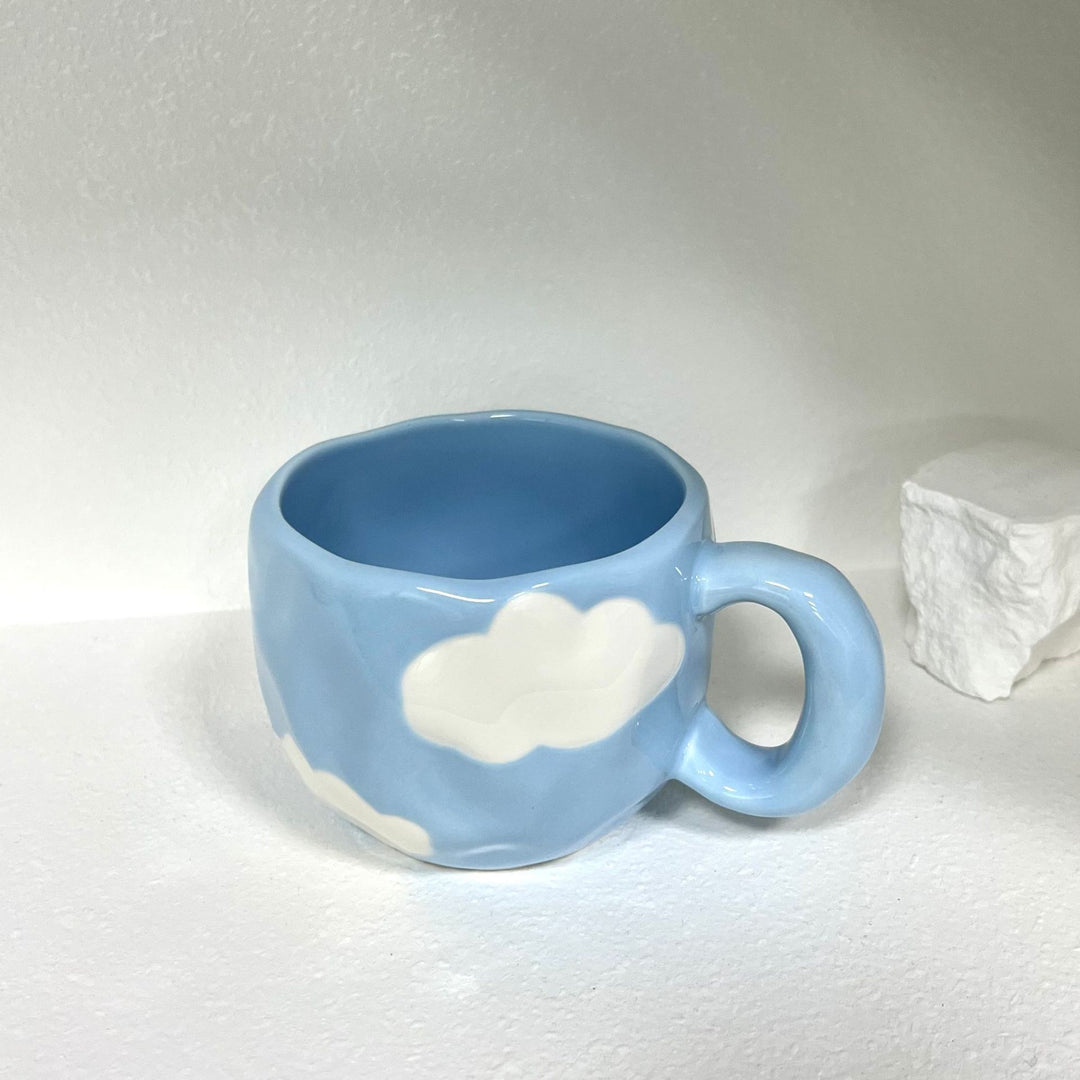 Ceramic mug with hand-painted tulip pattern and organic shape