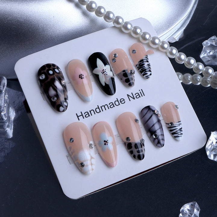 Nail art with elegant designs and embellishments Kalsten