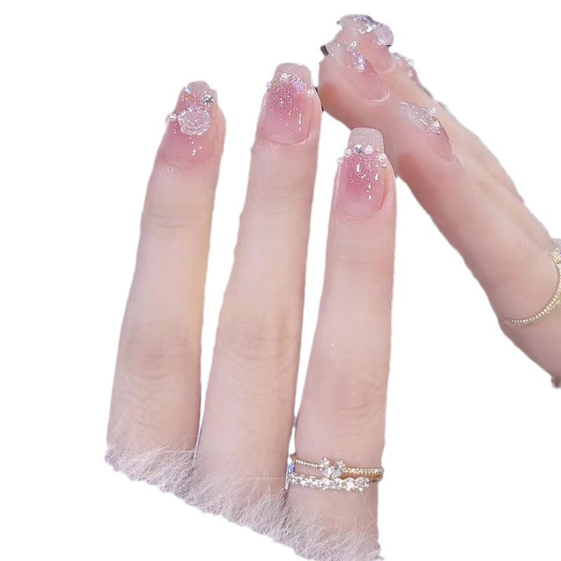 Glamorous nail art with rhinestone and pearl accents Kalsten